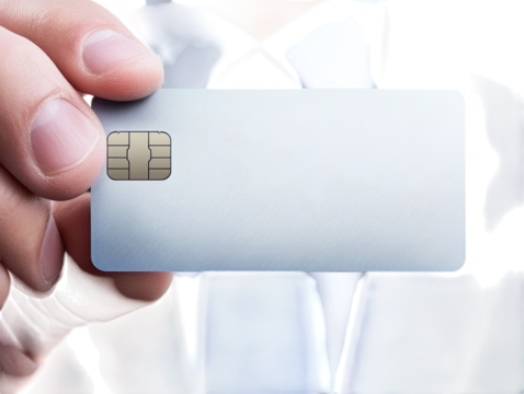 A business professional holds a blank credit card, emphasizing themes of finance, identity, and modern transactions.