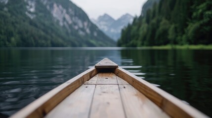 Obraz premium Wooden boat on a lake, mountain background, serene view
