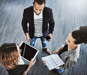 Above, tablet and business people in office, charts and finance report for profit growth....
