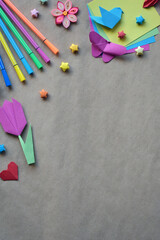 Creative DIY Paper Craft Workspace with Origami Birds, Hearts, Flowers, and Stationery Tools Arranged in a Border Frame Style