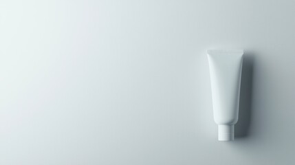 A single tube of hand cream standing upright against a white background, with its minimalist packaging and brand name clearly visible.