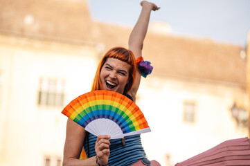 Young activist celebrating at pride parade supporting lgbtq plus community