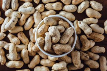 Peanuts on wooden background