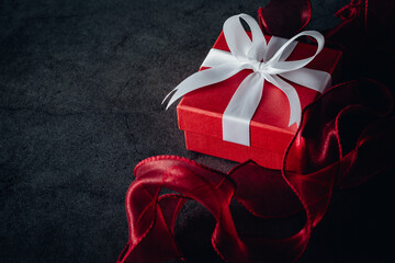 red gift box on black background