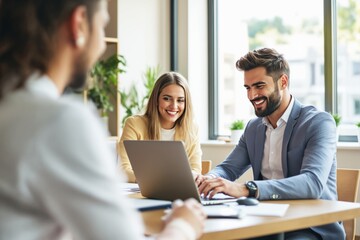 Obraz premium Professionals in a business meeting discussing work at a modern office with natural light.