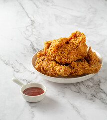 fried chicken on white table 