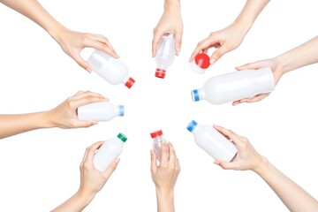 group of people holding up plastic bottles and utensils