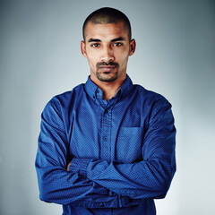 Obraz premium Arms crossed, professional and portrait of business man for advertising director, pride and creative. Marketing manager, advisor and consultant with person on white background in studio for career