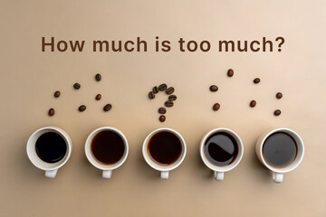 Row of Coffee Cups With Question About Caffeine Consumption on a Flat Surface