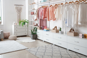 Modern wardrobe with stylish clothes and accessories