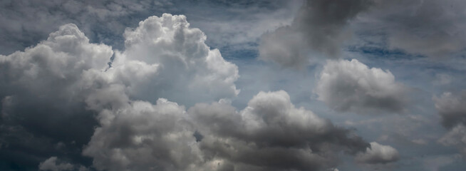 Banner Dramatic dark storm clouds black sky background. Dark thunderstorm clouds rainny season. Panorama Meteorology danger windstorm disasters climate. Dark cloudscape storm cloud with copy space.