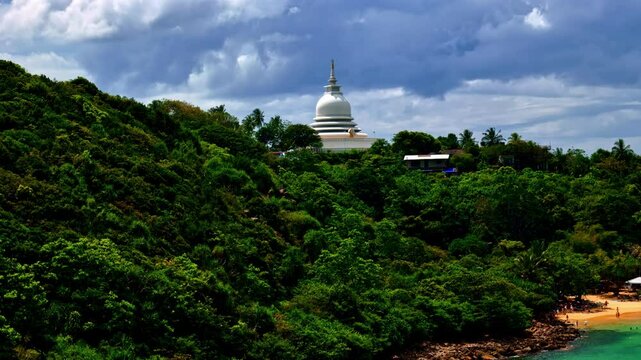 Drone aerial reveal, Japanese Peace Pagoda buddhist temple, Rumassala, Sri Lanka