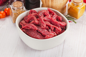 Raw beef meat - sliced strips