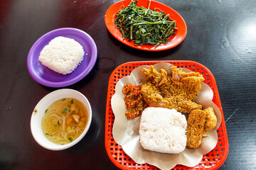 Crispy chicken, vegetables, soup and kale are ready to eat