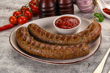 Grilled beef sausages with sauce