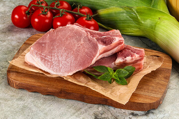 Raw pork steak loin with bone