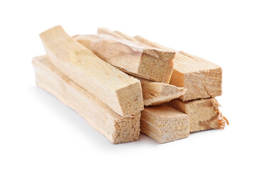 Pile of palo santo sticks on white background