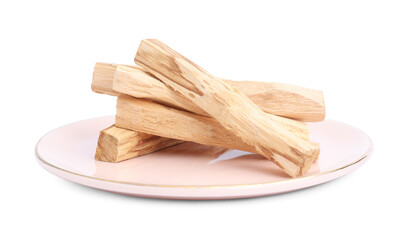 Pile of palo santo sticks on white background