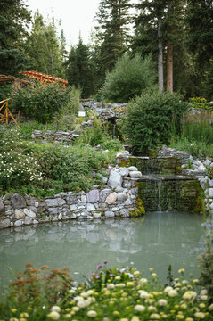 Cascading waterfall surrounded by greenery in Cascade of Time Gardens