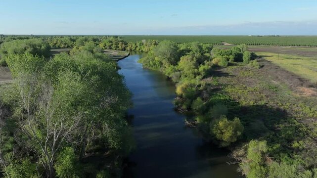 Aerial view over San Joaquin River irrigation canal in farmland