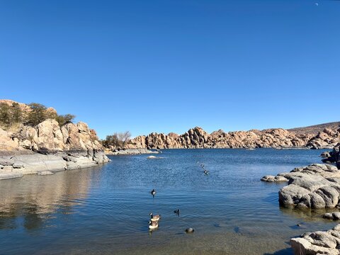 Watson Lake in Prescott, AZ, with rocky shoreline, clear water, ducks