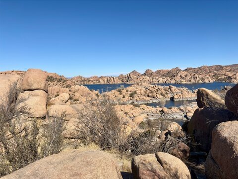 Rugged rock formations and calm waters of Watson Lake in Prescott, AZ