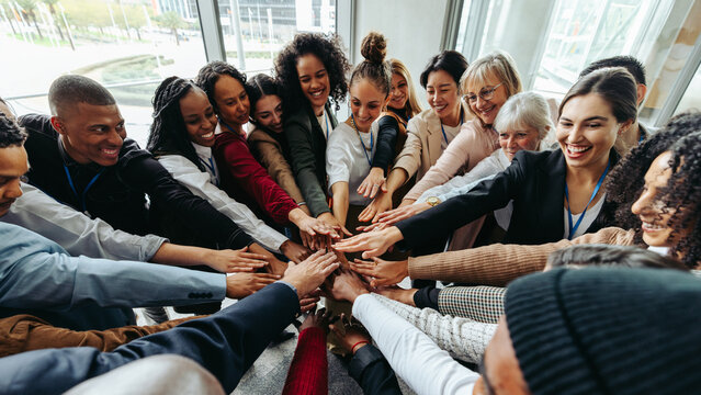 Successful team working together in a collaborative environment with diversity and unity