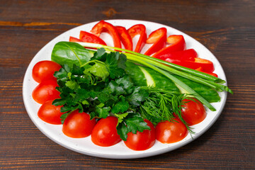 Fresh vegetables arranged beautifully on a white plate