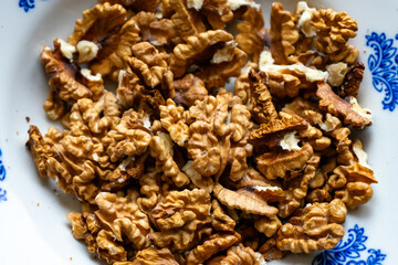 Walnuts arranged on a decorative plate for healthy snacking