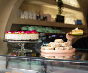 Artisanal pastry display on the counter of a vegan coffee shop