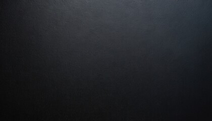 Fototapeta premium Dark Charcoal Backdrop: A minimalist photograph showcasing a plain, texture-rich charcoal-colored surface, offering a sense of depth.