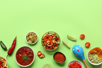 Traditional Mexican food and maraca on green background. Cinco de Mayo (Fifth of May) celebration