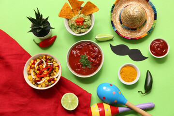 Traditional Mexican food and maraca on green background. Cinco de Mayo (Fifth of May) celebration