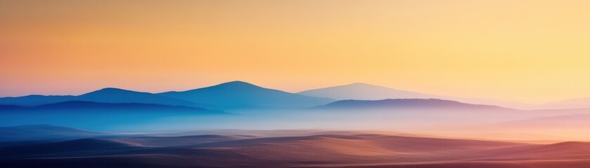 Obraz premium A serene landscape featuring layered mountains bathed in soft hues of blue and orange, creating a tranquil and picturesque scene at dawn or dusk.