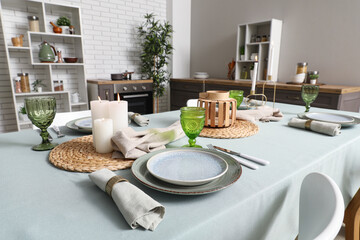 Stylish table setting for dinner in kitchen