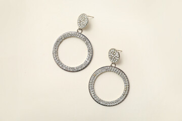 Beautiful silver earrings on white background