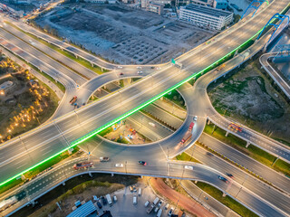 Aerial view of illuminated highway interchange at night