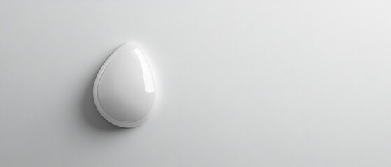 A white egg shaped object is on a white background