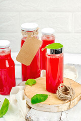 Homemade watermelon kombucha. Healthy probiotic drink, kvass with basil leaves. Fermented beverage