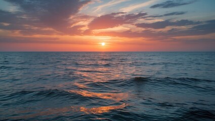 Fototapeta premium Vibrant Sunset Over Serene Ocean Waves Creating a Calming Seascape in Warm Hues of Orange and Pink