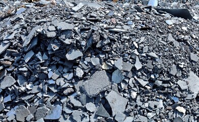 Steel slags and iron lumps from metallurgical industry ready for recycling. Full frame, background...