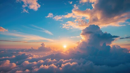 Serene morning sunrise over fluffy clouds with vibrant blue sky and delicate wispy clouds creating a tranquil atmosphere.