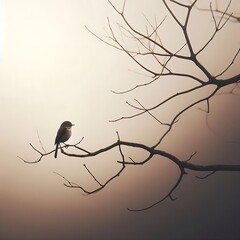 A small bird perches quietly on a bare branch against a soft, misty beige background, exuding tranquility and solitude.