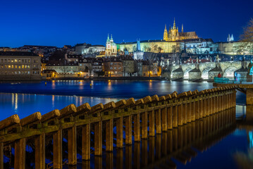 Panoramic night view of the iconic Charles Bridge over Vltava river and Prague Old town cityscape, in Prague, Czech Republic