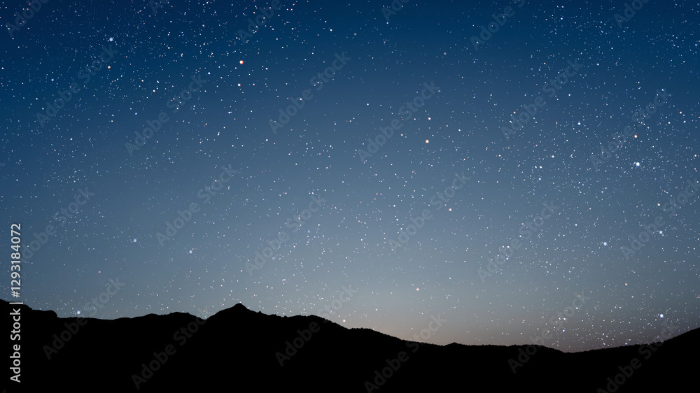 Canvas Prints a movement of stars in the night sky with the view of mountains..