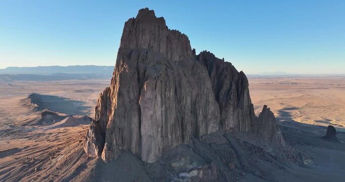 An unworldly, high-flying orbital aerial shot of the sacred &ldquo;Ship Rock&rdquo;, a massive, monolithic monadnock, towering above the high desert plain of the Navajo Nation, in New Mexico, United States.