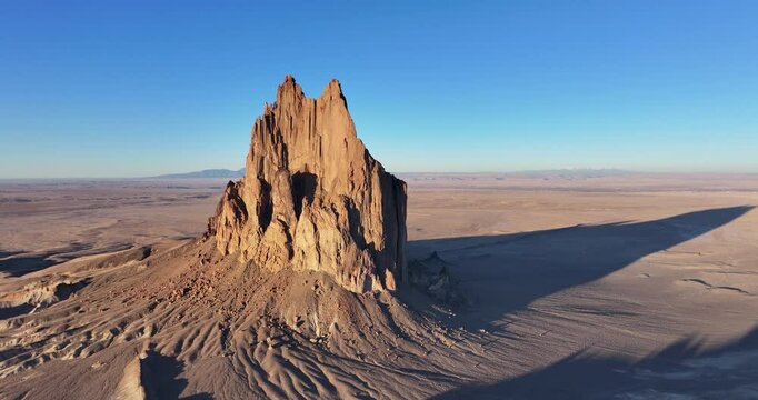 A beautiful, high-flying orbital aerial shot of the sacred &ldquo;Ship Rock&rdquo;, a massive, monolithic monadnock, towering above the high desert plain of the Navajo Nation, in New Mexico, United States.