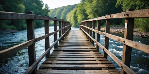 Obraz premium Picturesque Wooden Bridge Over Tranquil River Surrounded By Lush Greenery With Space For Customized Text And Captivating Visual Appeal
