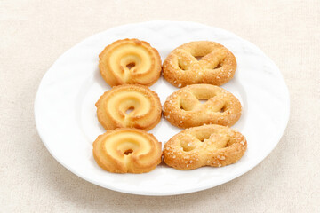Assorted of danish butter cookies, served on a white plate.

