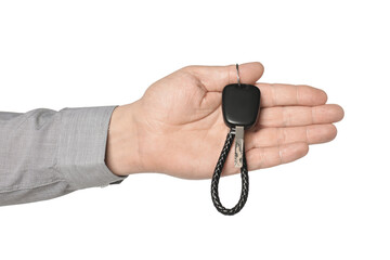 Man with car key and keychain on white background, closeup